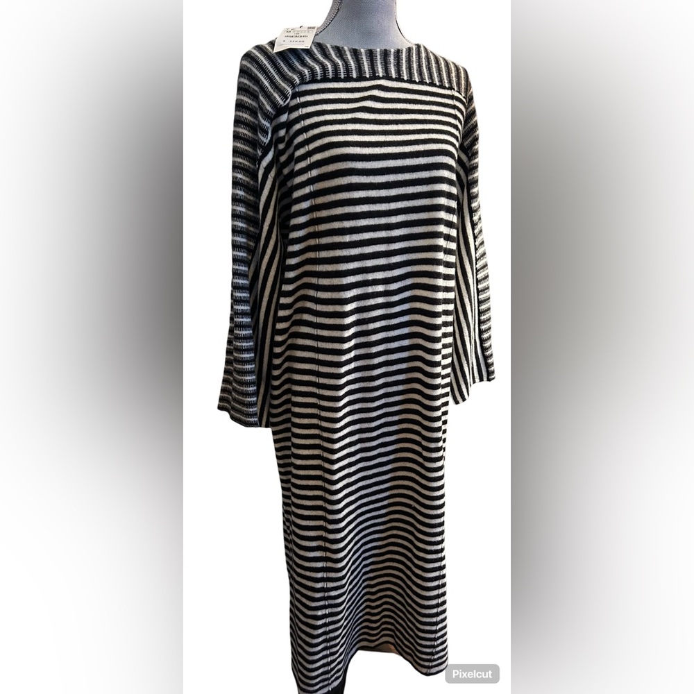 100% Wool. Long sweater dress with wide slits on sleeves!